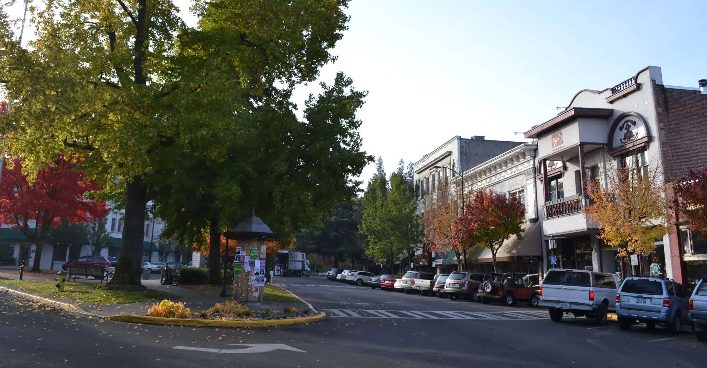 Historic storefronts and autumn street trees along the Plaza in downtown Ashland, Oregon